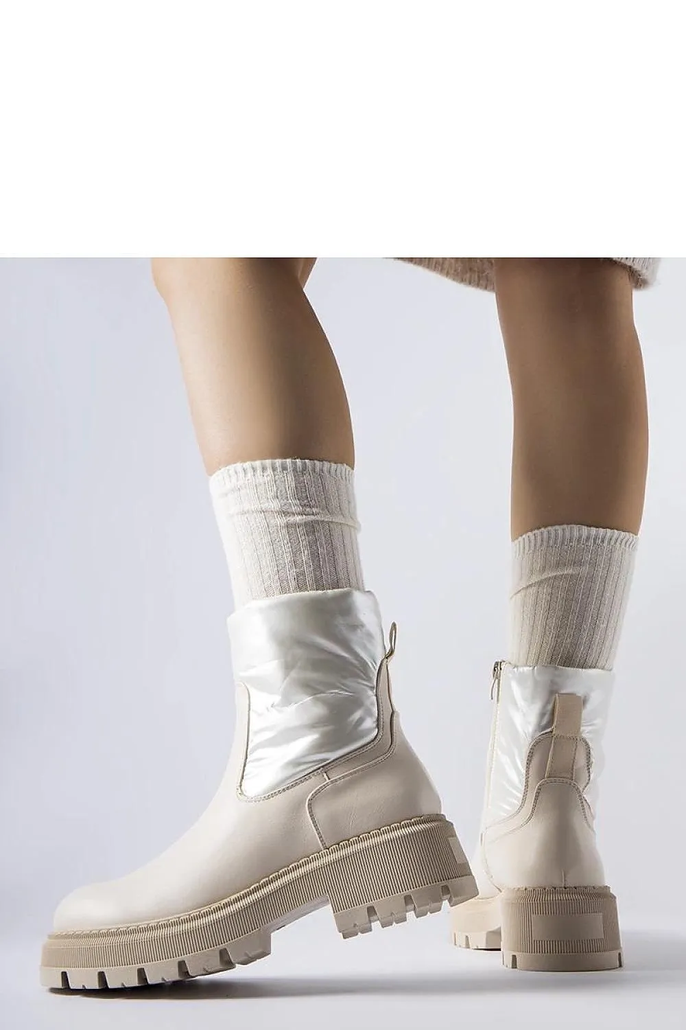 Beige ankle boots with a decorative shaft