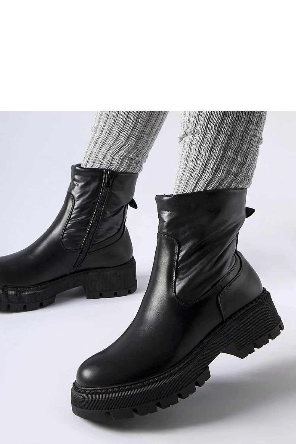Beige ankle boots with a decorative shaft