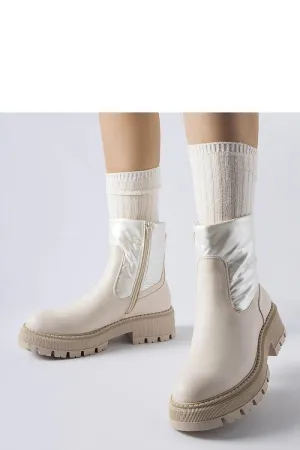 Beige ankle boots with a decorative shaft