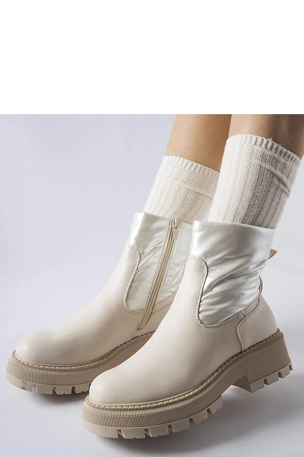 Beige ankle boots with a decorative shaft