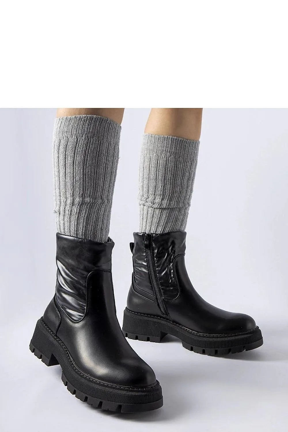 Beige ankle boots with a decorative shaft