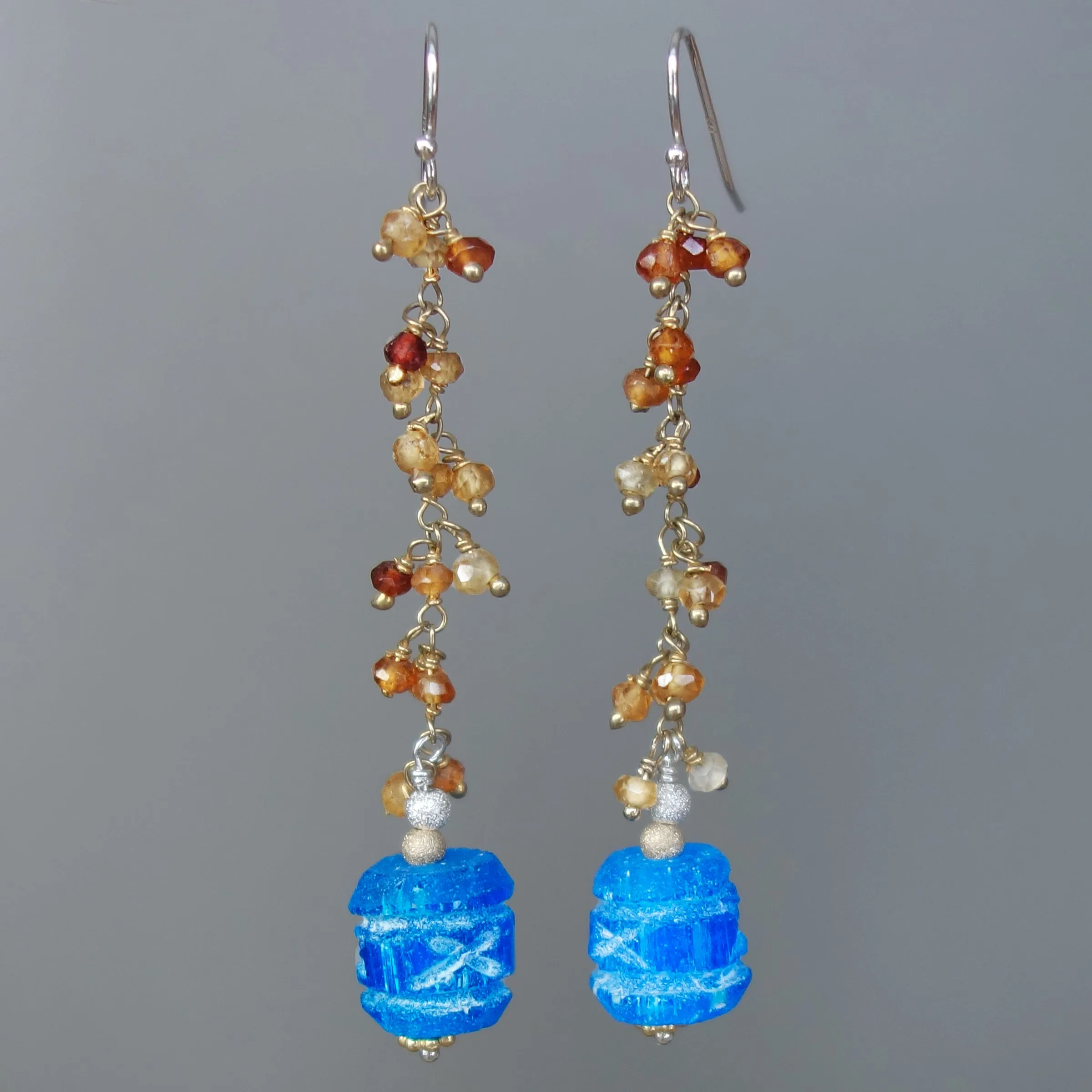 Carved apetite and hessonite garnet earring