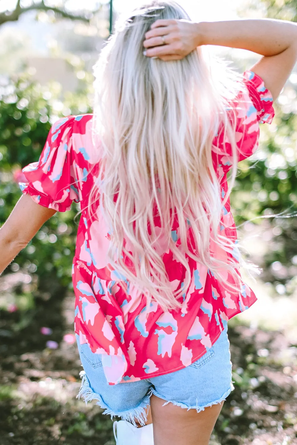 Kiara Peplum Printed Notched Short Sleeve Blouse